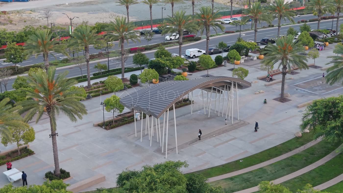Architectural Detail of Civita Park’s Arched Canopy and Palm Plaza – Wide Establishing Frame