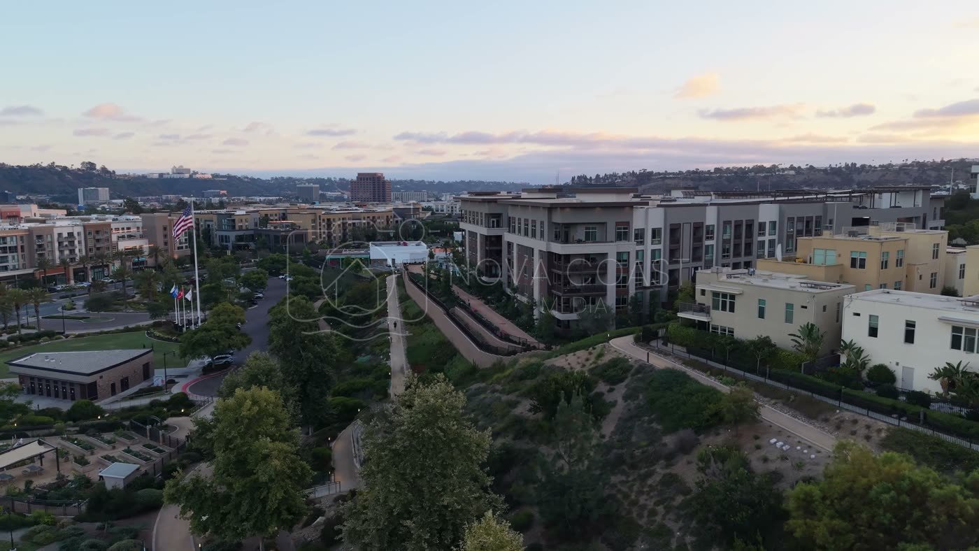 Civita Hilltop Residences Above the Community Garden Terraces at Dusk – Elevated Perspective