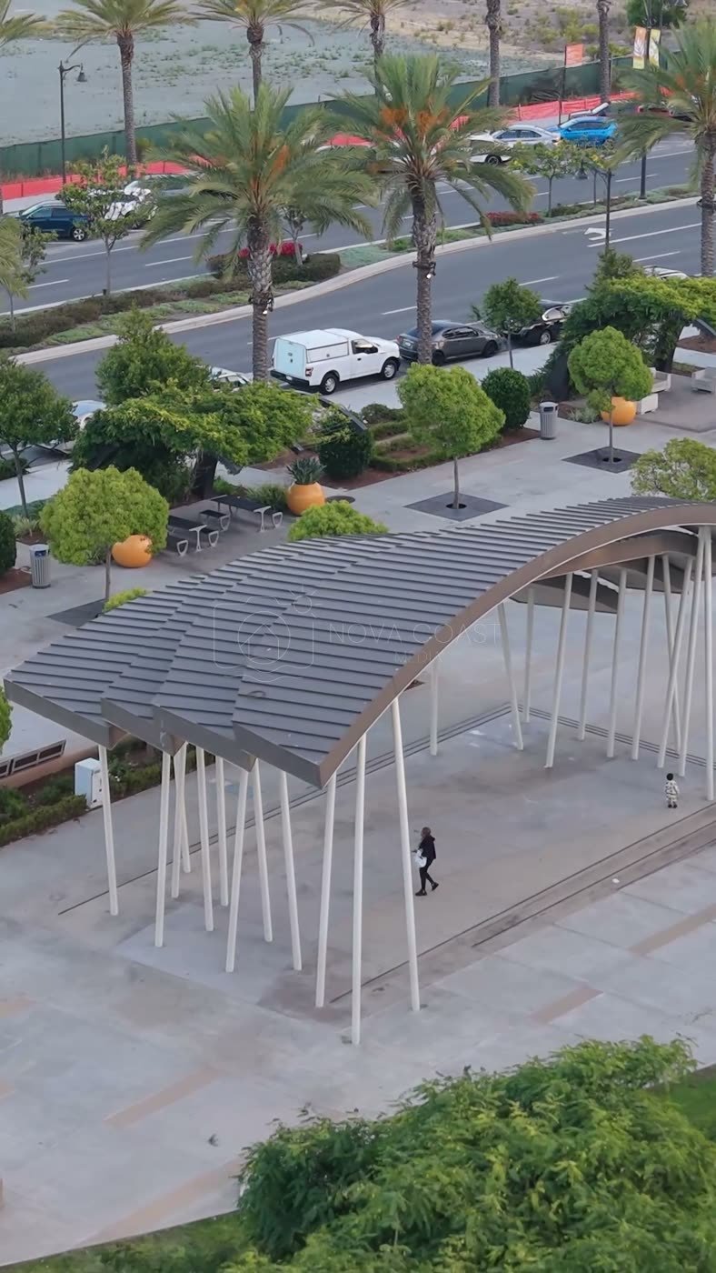 Architectural Detail of Civita Park’s Arched Canopy and Palm Plaza – Overhead Detail (Vertical)