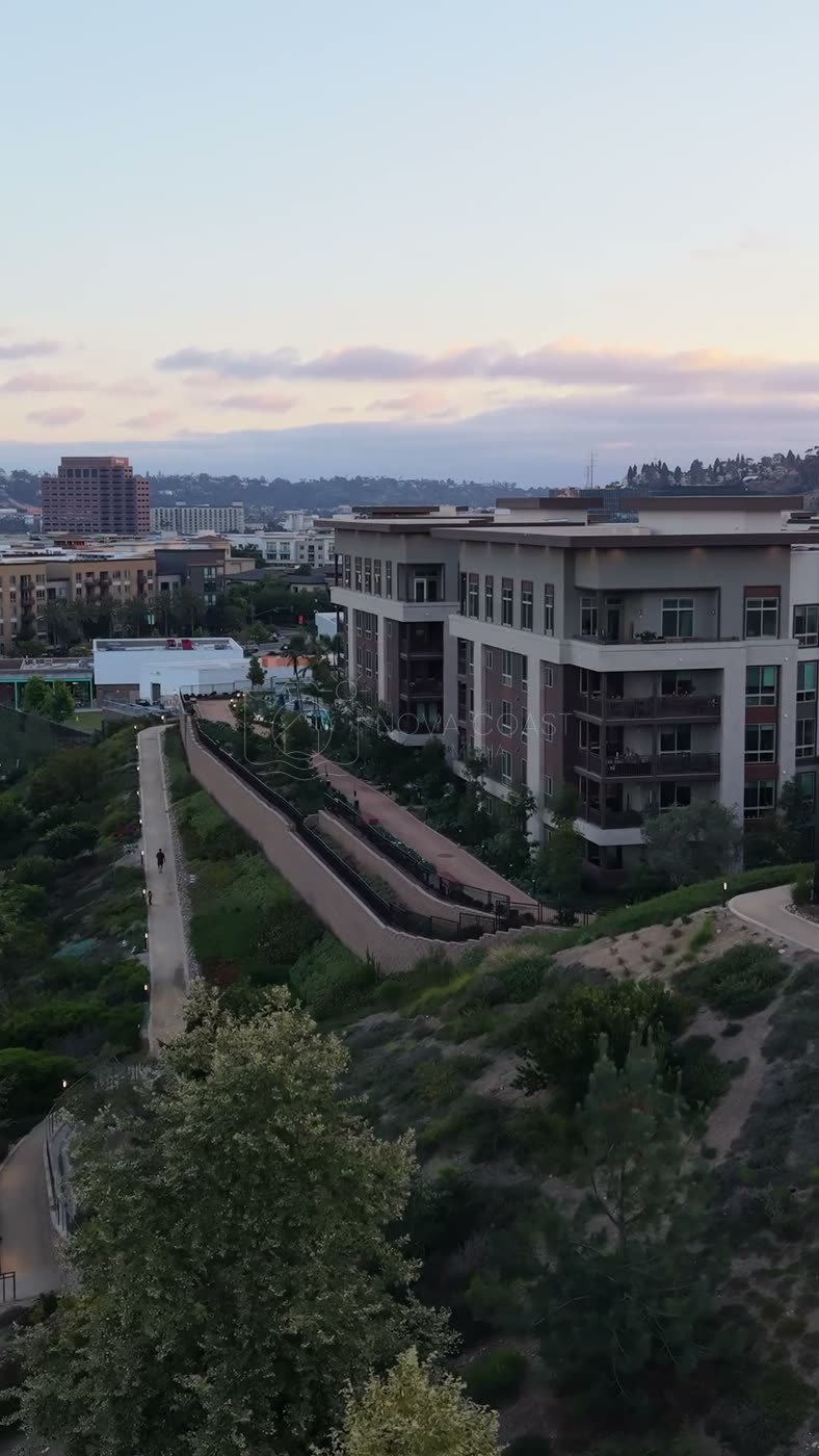Civita Hilltop Residences Above the Community Garden Terraces at Dusk – Elevated Perspective (Vertical)