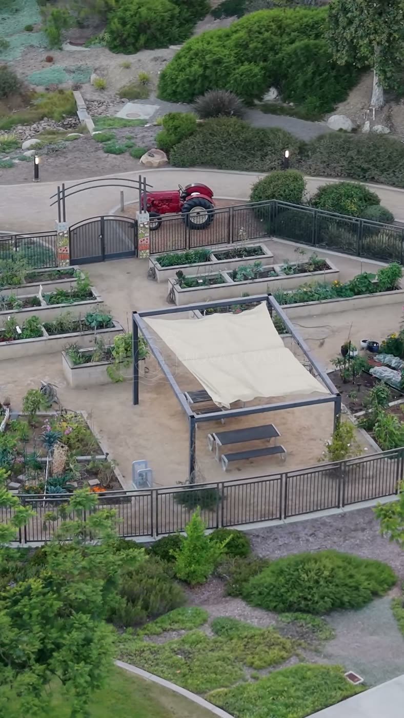 Overhead of the Civita Community Garden Plots and Shade Pavilion – Wide Establishing Frame (Vertical)