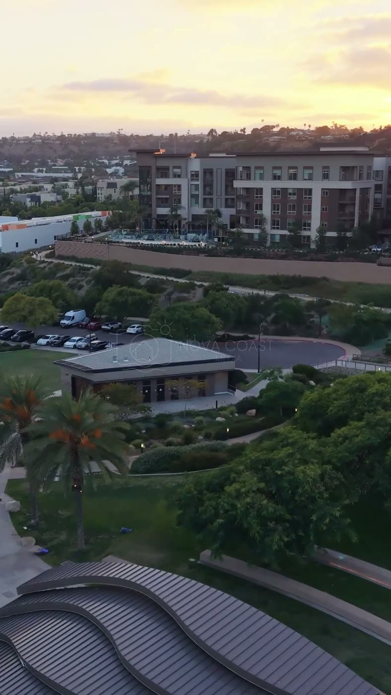 Civita Palm-Lined Boulevard and Park as the Sun Sets Over the Ridge – Overhead Detail (Vertical)