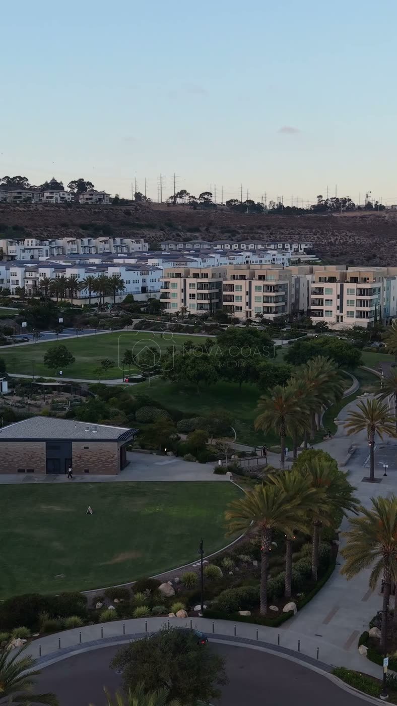 Civita Park Great Lawn and Flag Court Beside the Palm Promenade – Aerial View (Vertical)