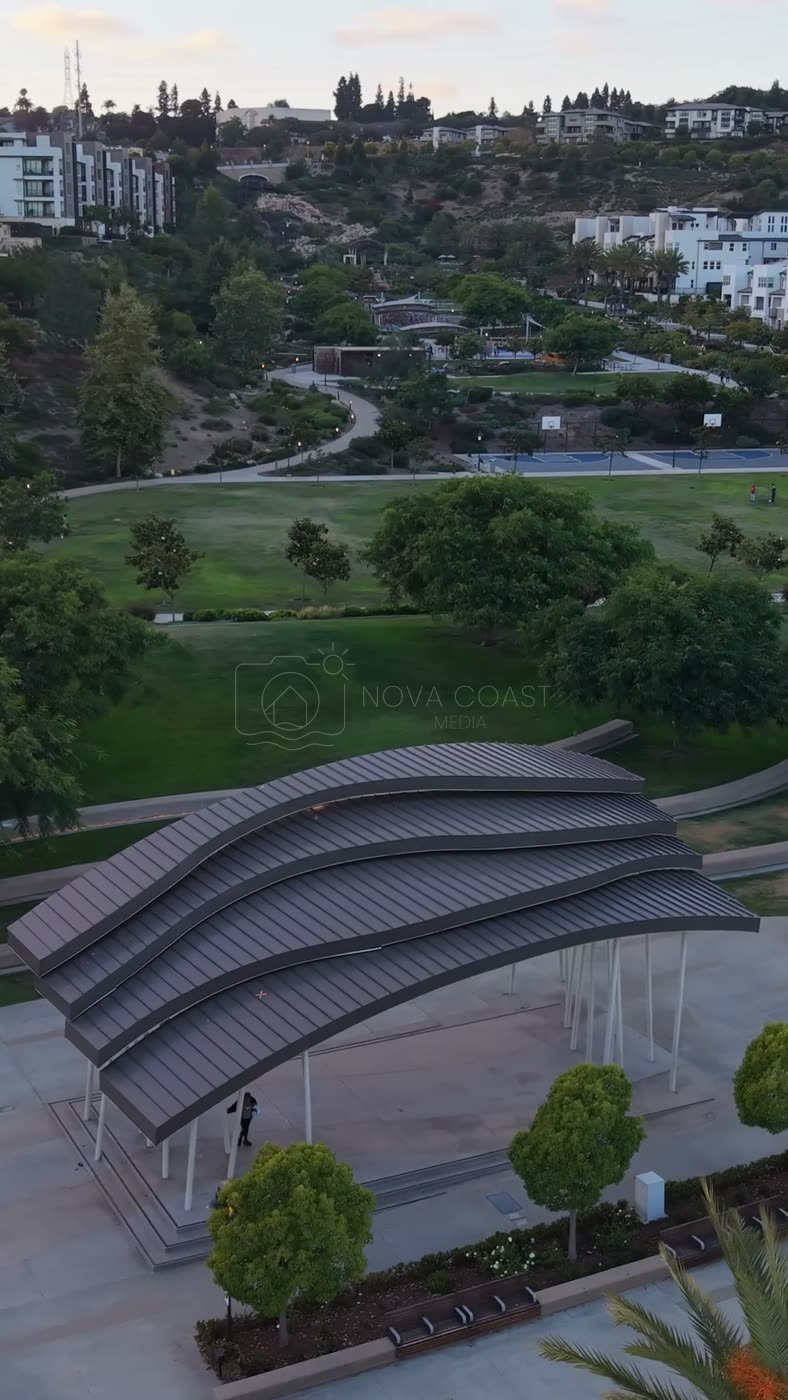 Civita Park Curved Steel Amphitheater Pavilion Above the Green – Elevated Perspective (Vertical)