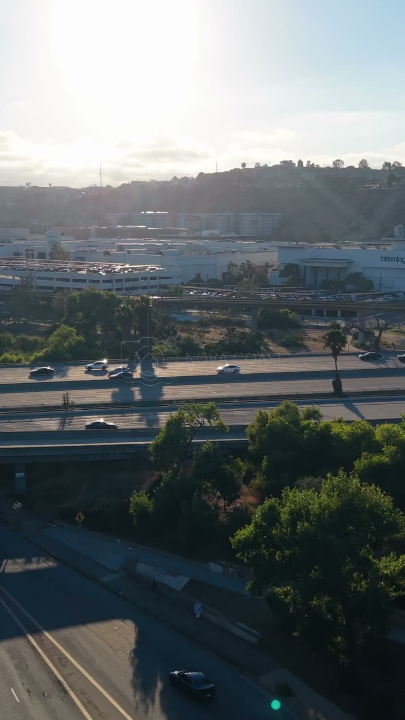 Fashion Valley Mall and the Freeway Interchange Under Morning Sun – Aerial View (Vertical)