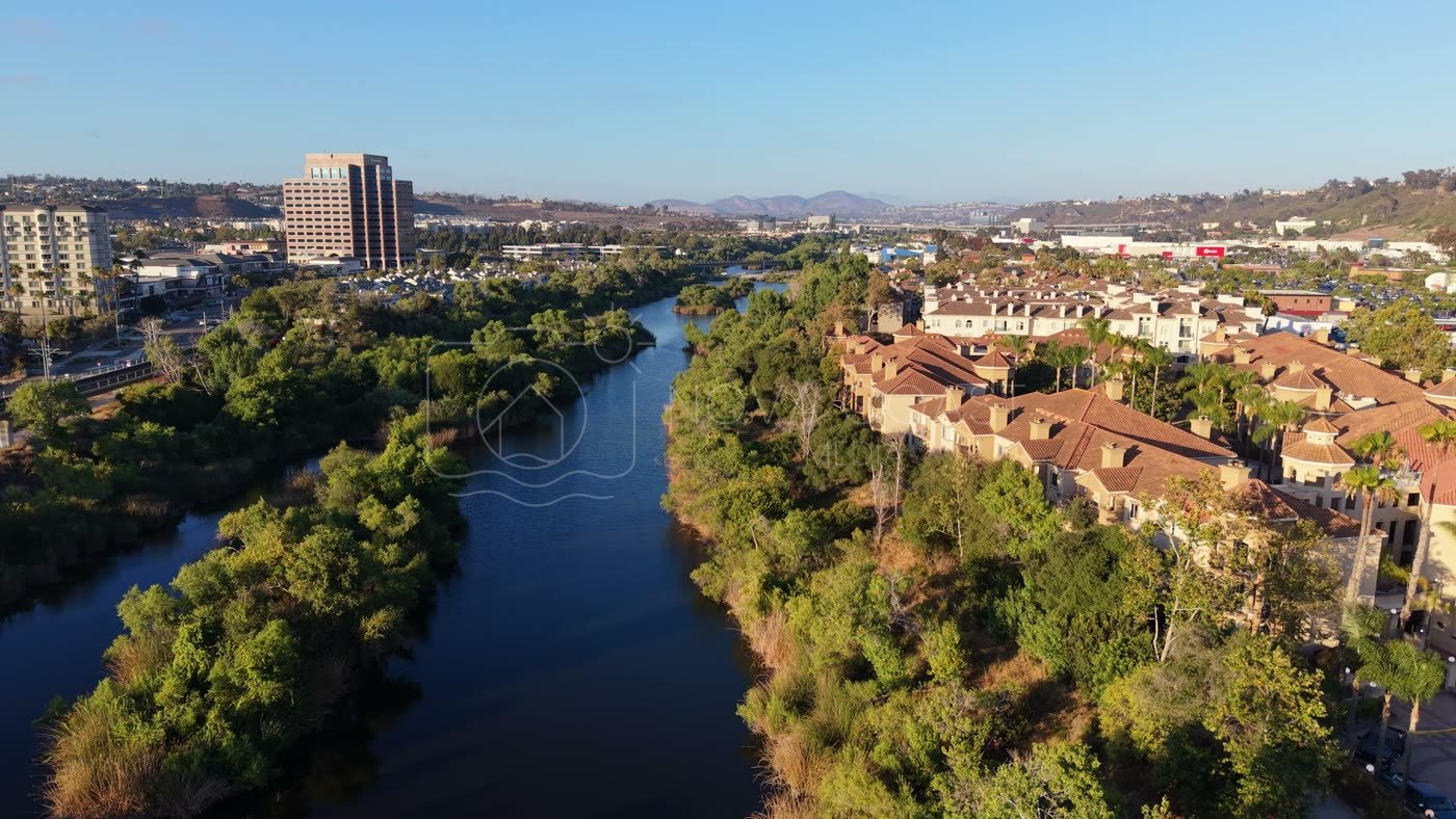 San Diego River Winding Past Riverside Townhomes in Mission Valley – Aerial View