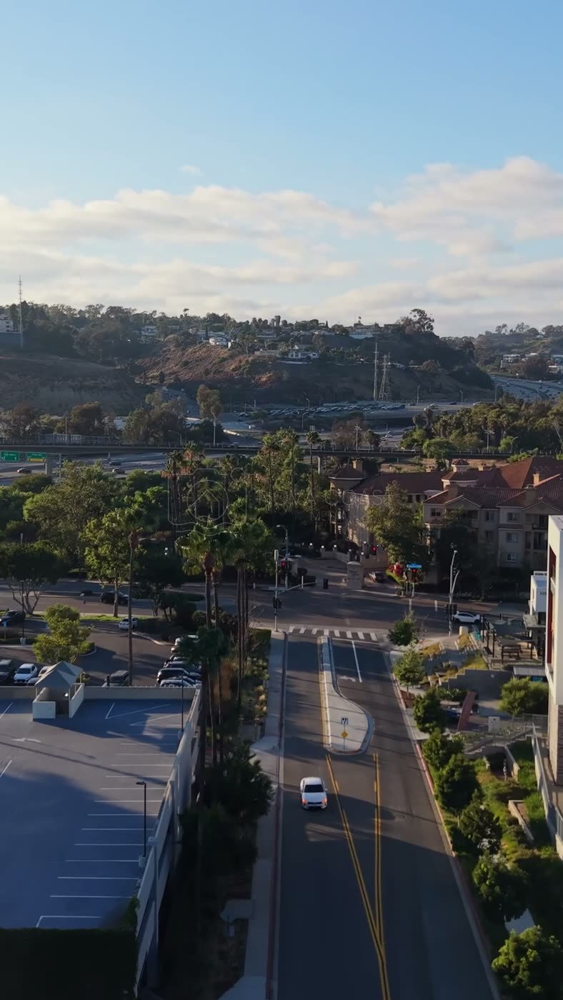 Mission Valley Streetscape with Apartments and Freeway Beyond at Morning – Elevated Perspective (Vertical)