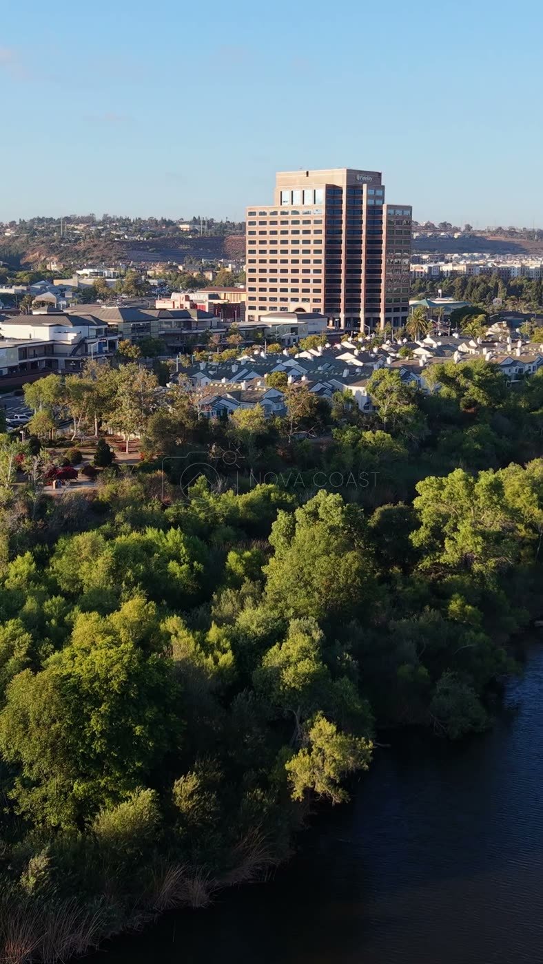 Lush San Diego River Bend Below the Mission Valley Skyline – Aerial View (Vertical)