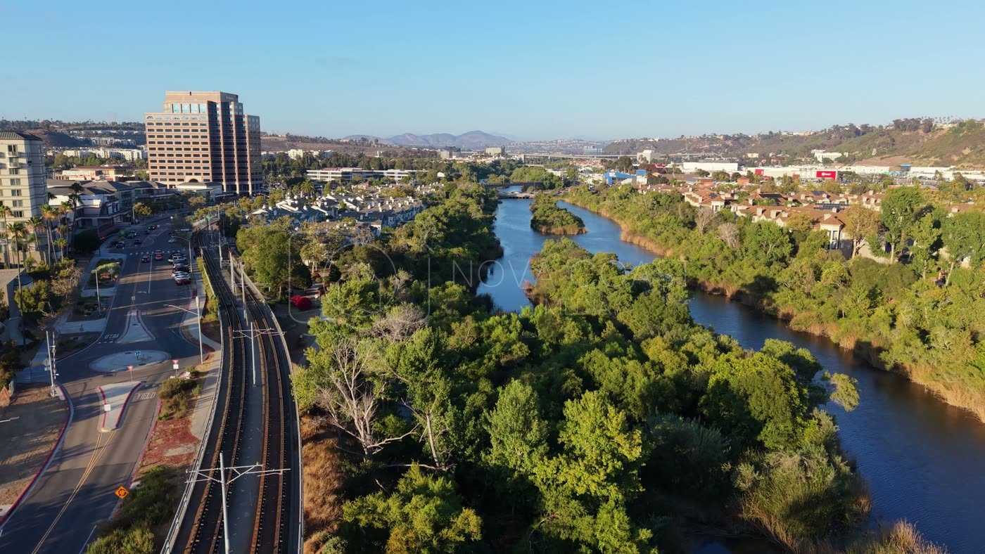San Diego River Reflections Beside the Trolley Line and Office Tower – Aerial View