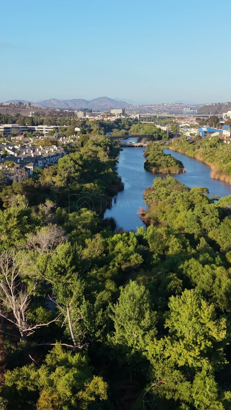 San Diego River Reflections Beside the Trolley Line and Office Tower – Aerial View (Vertical)