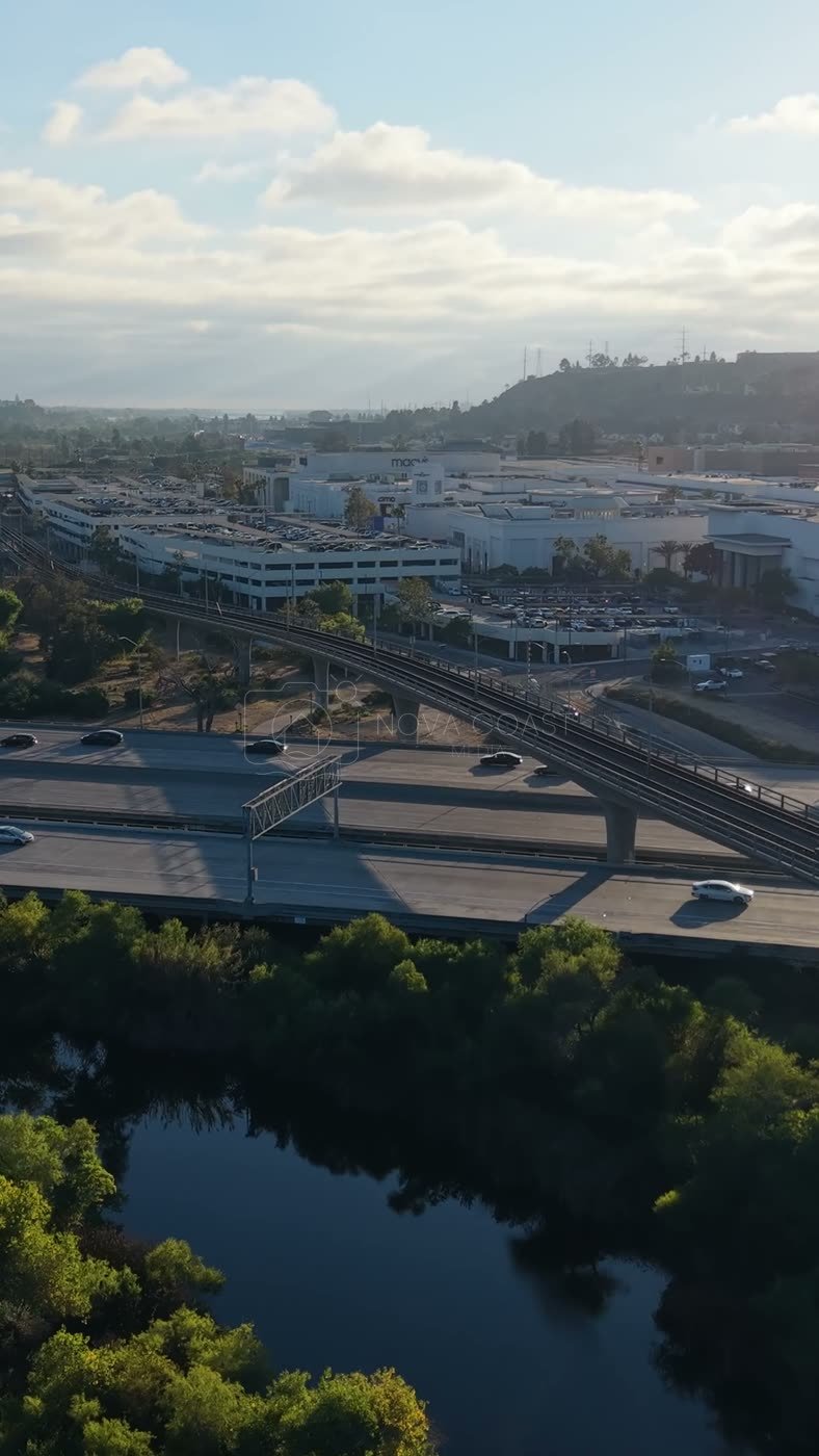 Trolley and Freeway Crossing the River Toward Mission Valley Mall at Sunset – Elevated Perspective (Vertical)
