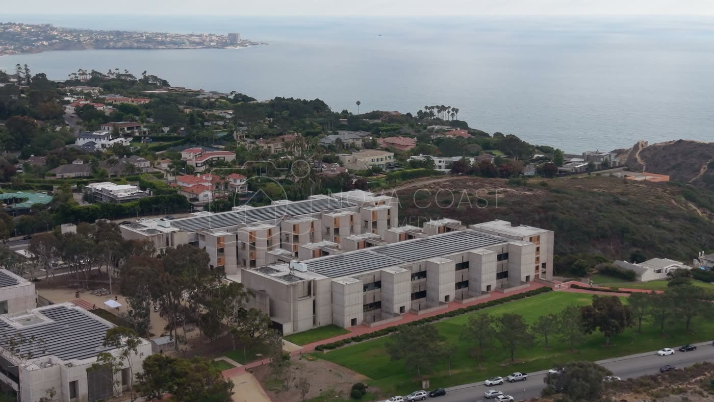 Aerial Profile of the Salk Institute Above La Jolla Shores – Wide Establishing Frame