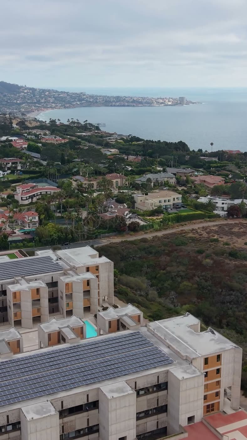Salk Institute’s Twin Concrete Wings Above the La Jolla Bluffs – Wide Establishing Frame (Vertical)
