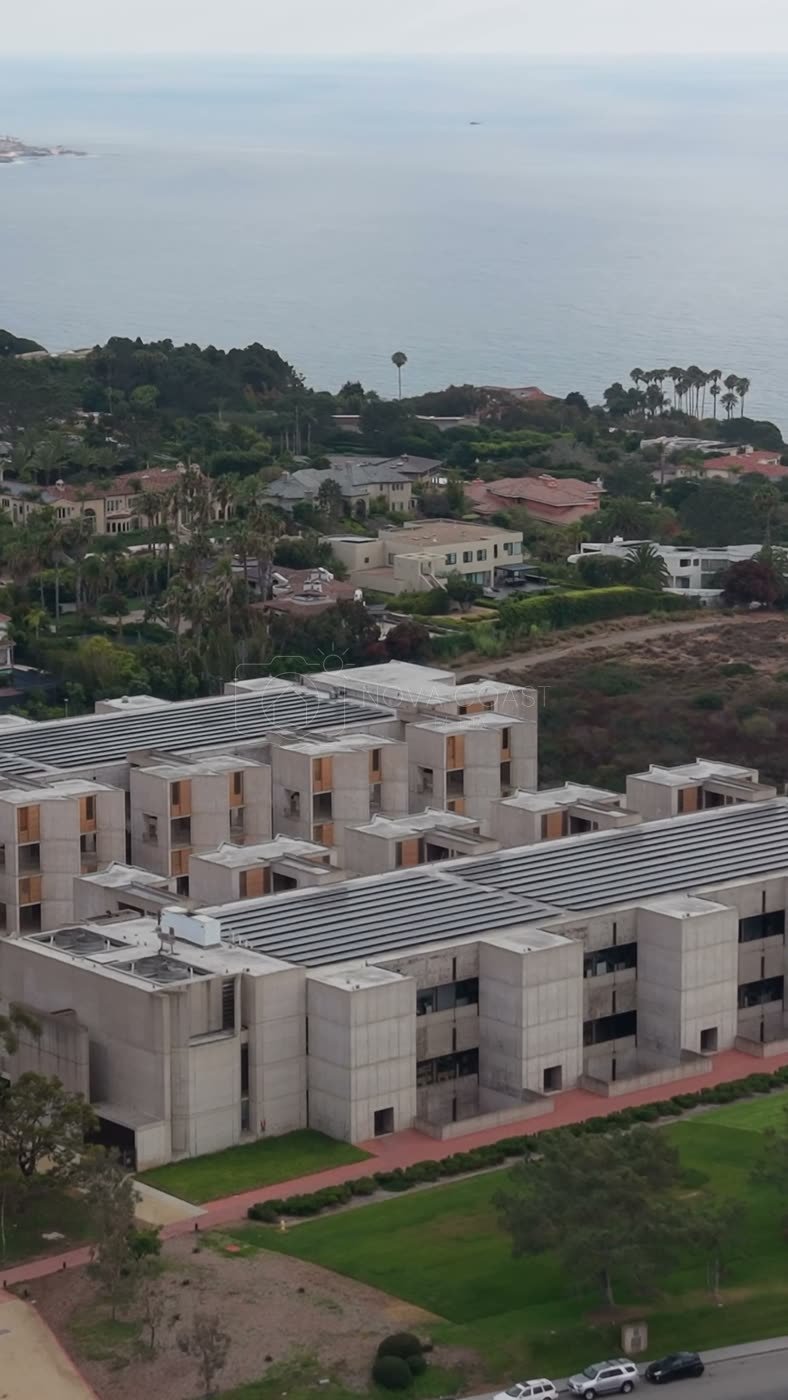 Aerial Profile of the Salk Institute Above La Jolla Shores – Wide Establishing Frame (Vertical)