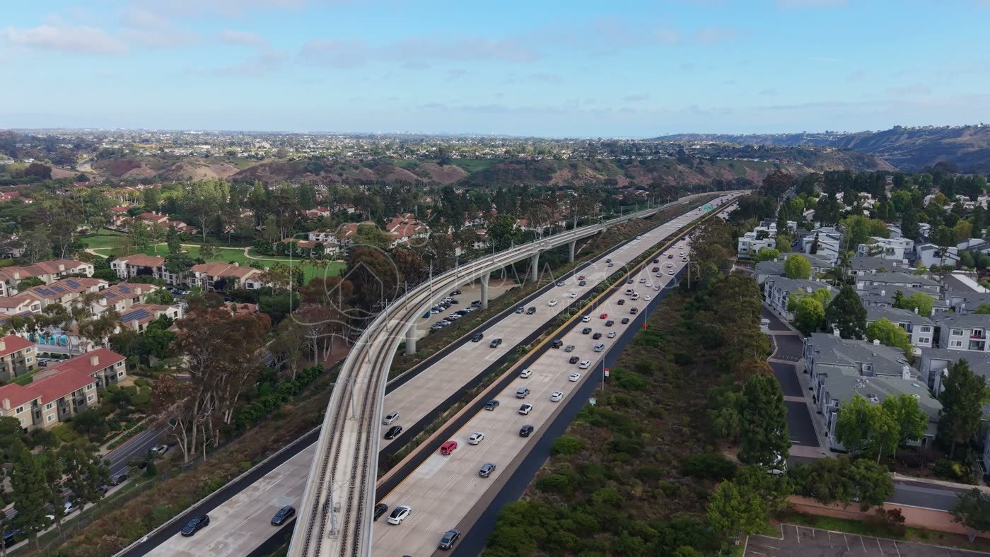 Elevated Trolley Guideway Curving Above the I-5 in University City – Aerial View