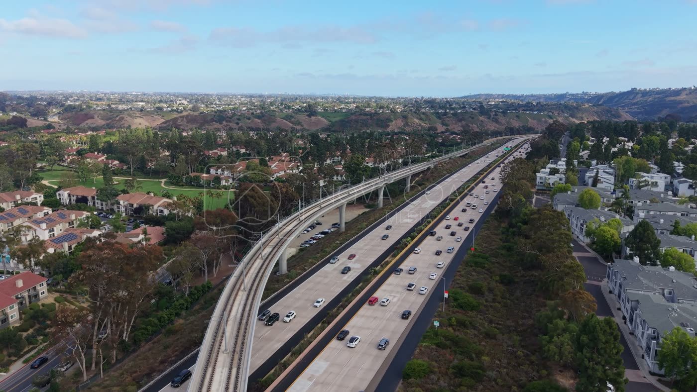 Elevated Trolley Guideway Curving Above the I-5 in University City – Elevated Perspective