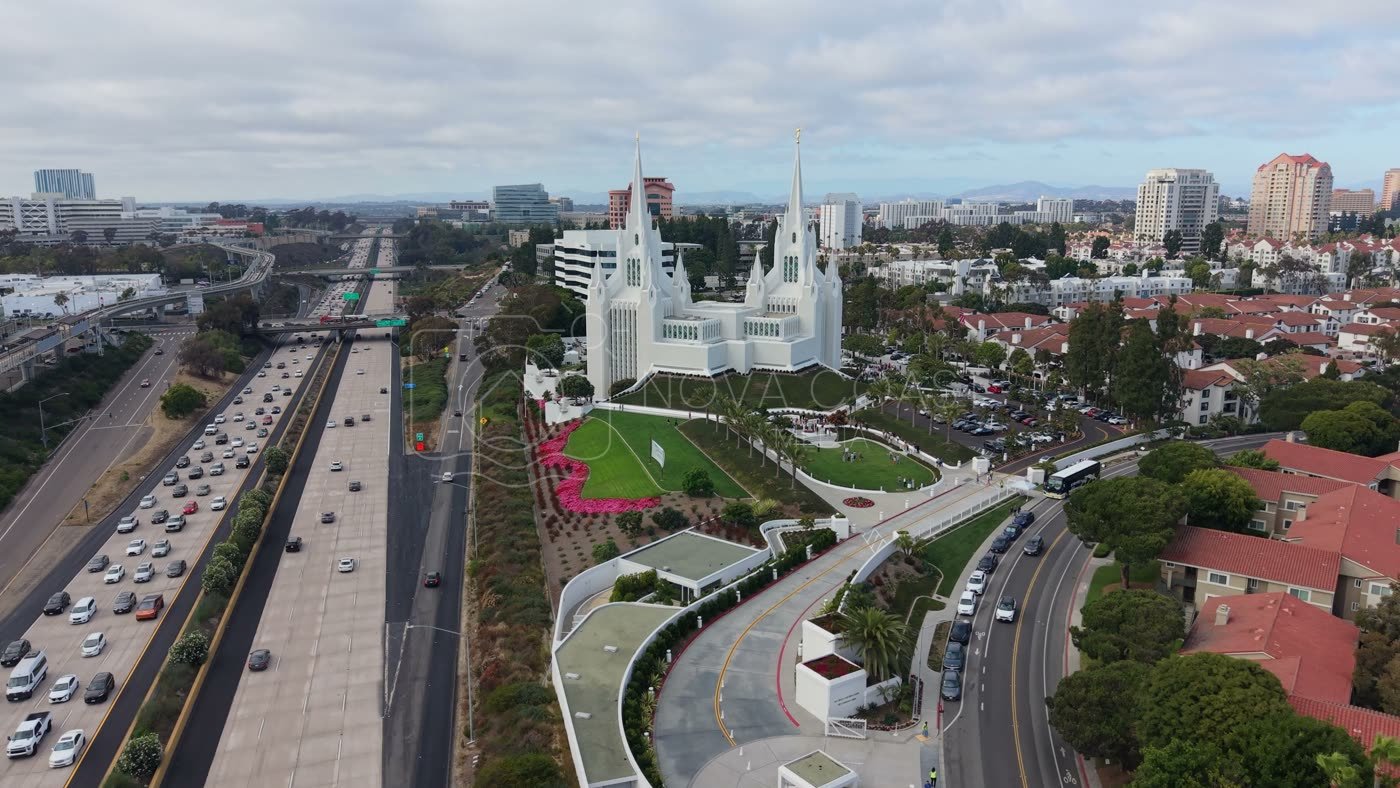 Twin-Spired San Diego Temple Above University City at Midday – Aerial View