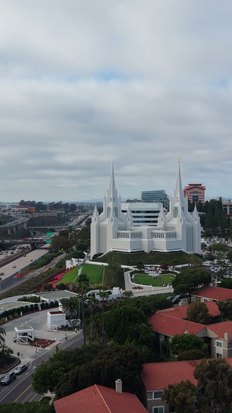 San Diego Temple Rising Beyond University City Rooftops – Wide Establishing Frame (Vertical)
