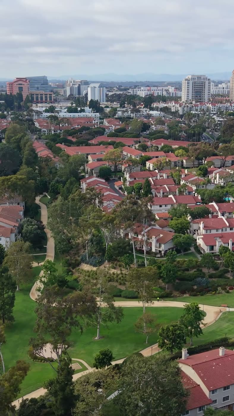 University City Neighborhood and Green Belt Beneath the UTC Skyline – Cinematic Drone Angle (Vertical)
