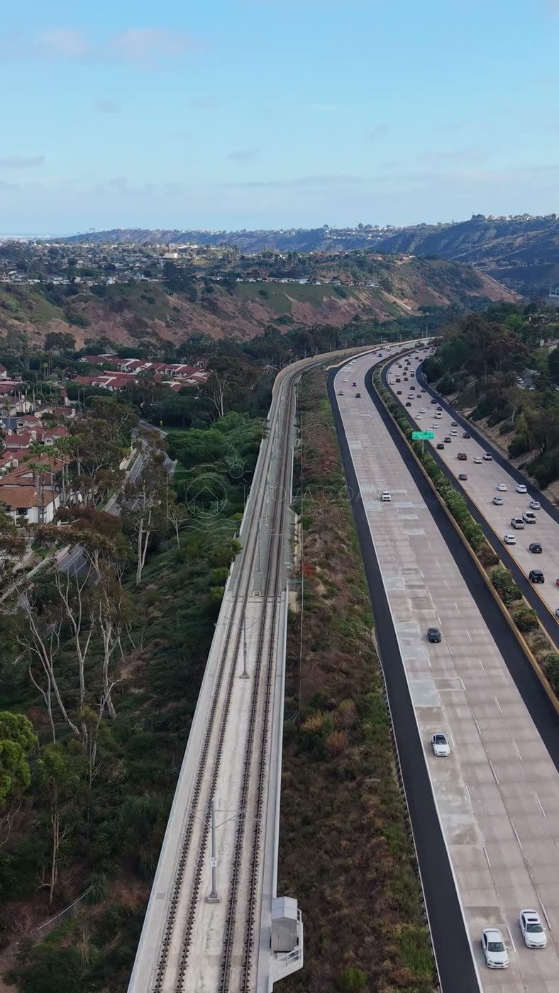Interstate 5 and the Trolley Line Winding Through University City – Aerial View (Vertical)