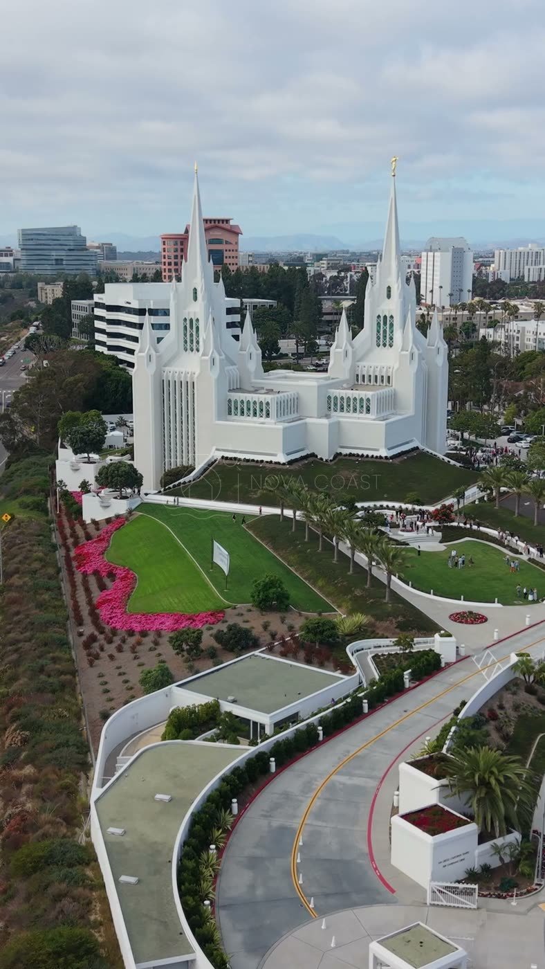 Twin-Spired San Diego Temple Above University City at Midday – Aerial View (Vertical)