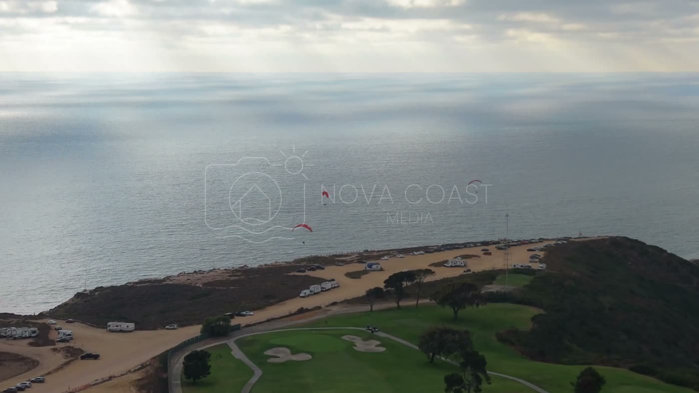 Paragliders Soaring Over the Pacific at Torrey Pines Gliderport – Aerial View