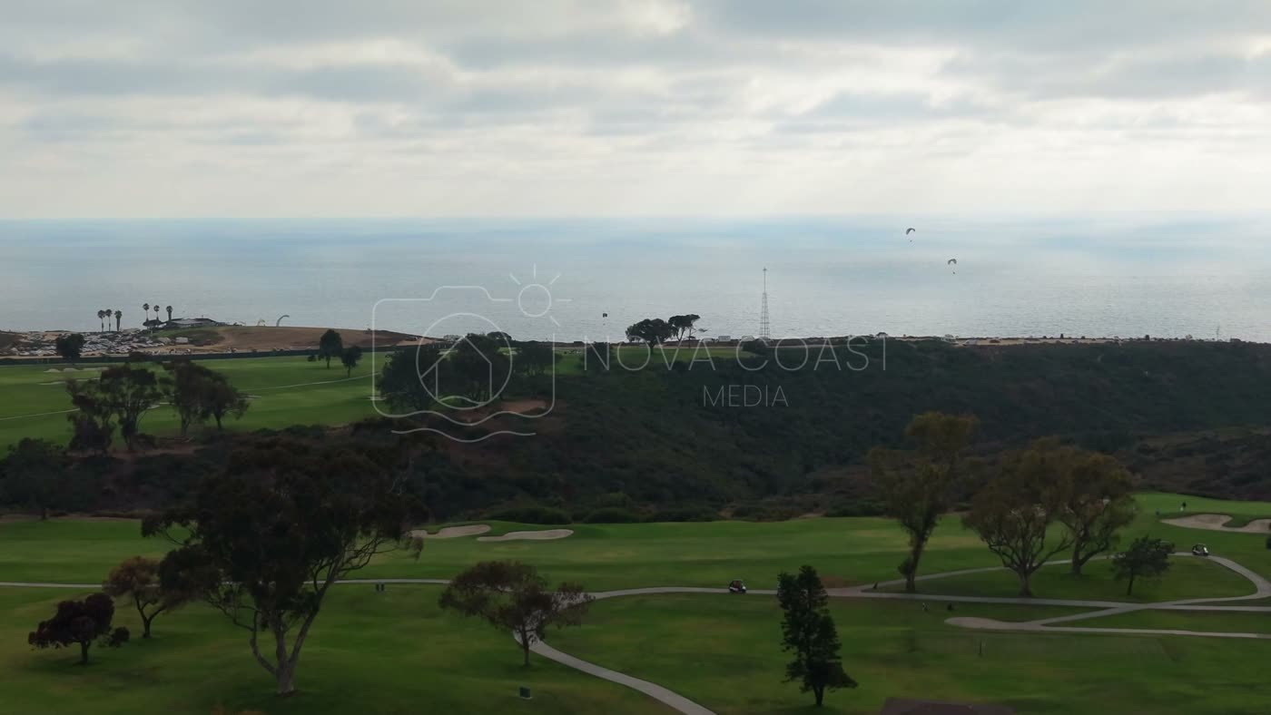 Distant Paragliders Over the Pacific Beyond Torrey Pines Fairways – Aerial View