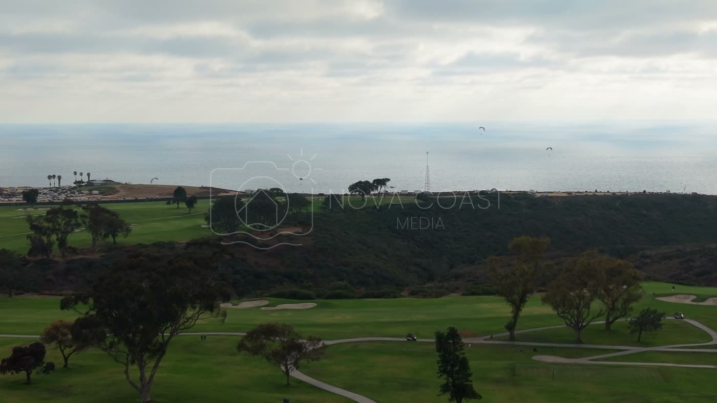 Distant Paragliders Over the Pacific Beyond Torrey Pines Fairways – Elevated Perspective