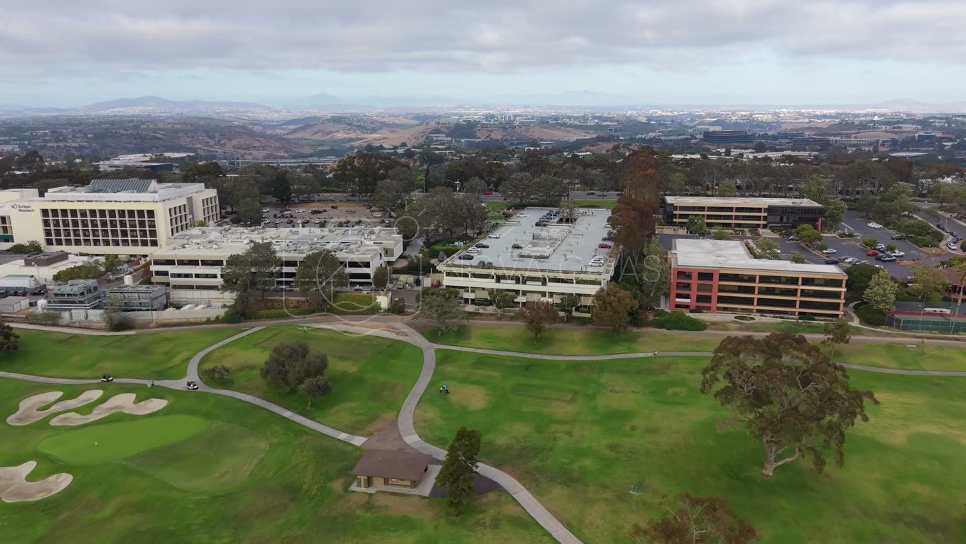 Torrey Pines Greens Beside the Science Park and Mesa Skyline – Wide Establishing Frame