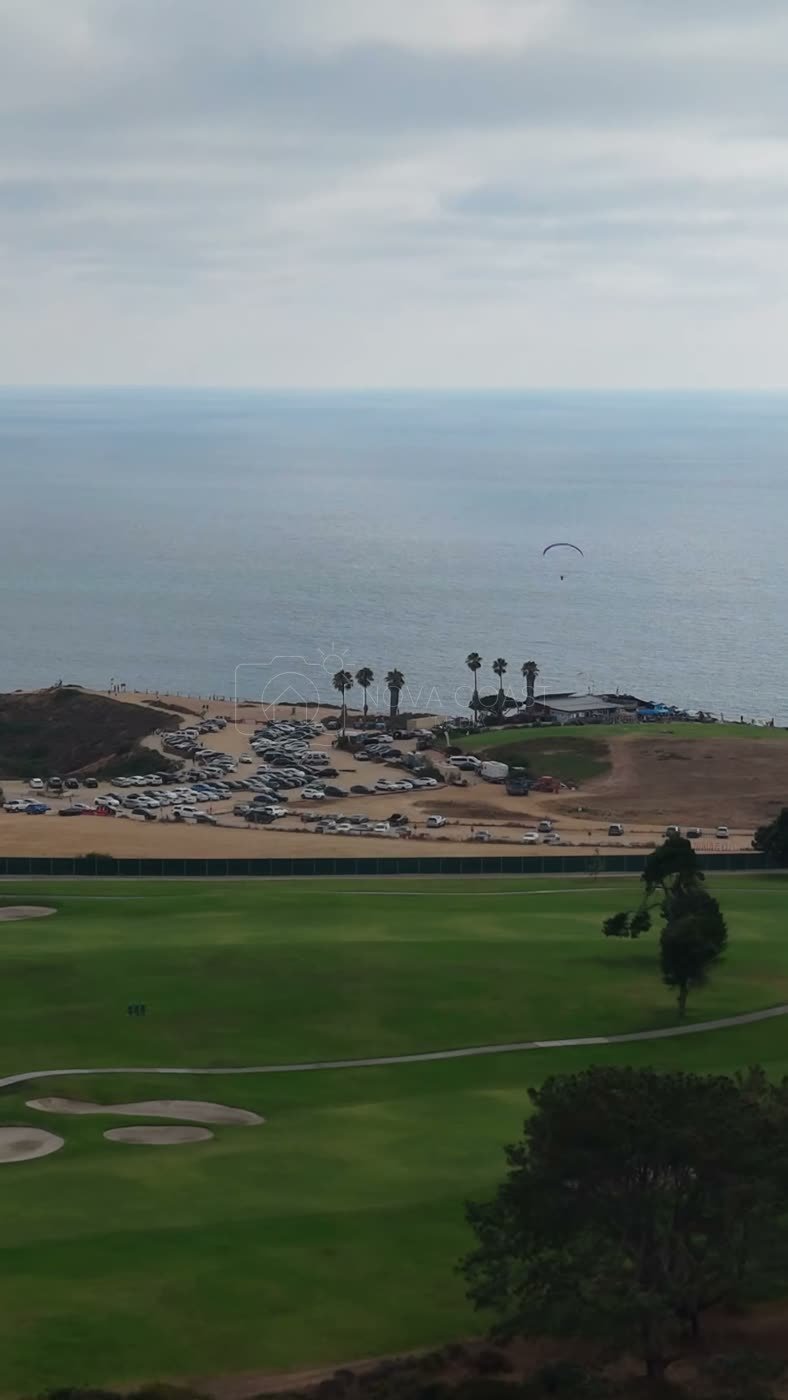 Torrey Pines Fairways with Paragliders Drifting Over the Sea – Aerial View (Vertical)