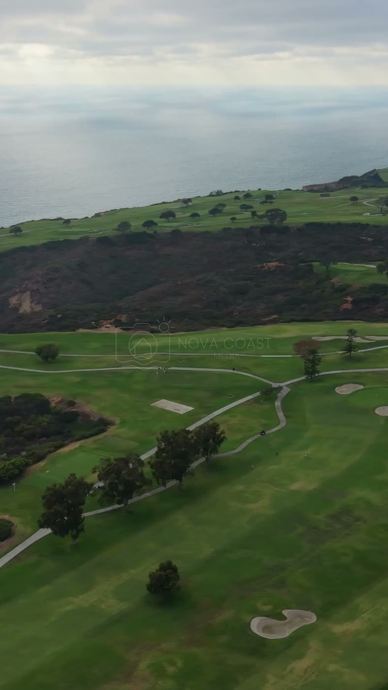 Clifftop Fairways of Torrey Pines Overlooking the Sunlit Pacific – Aerial View (Vertical)