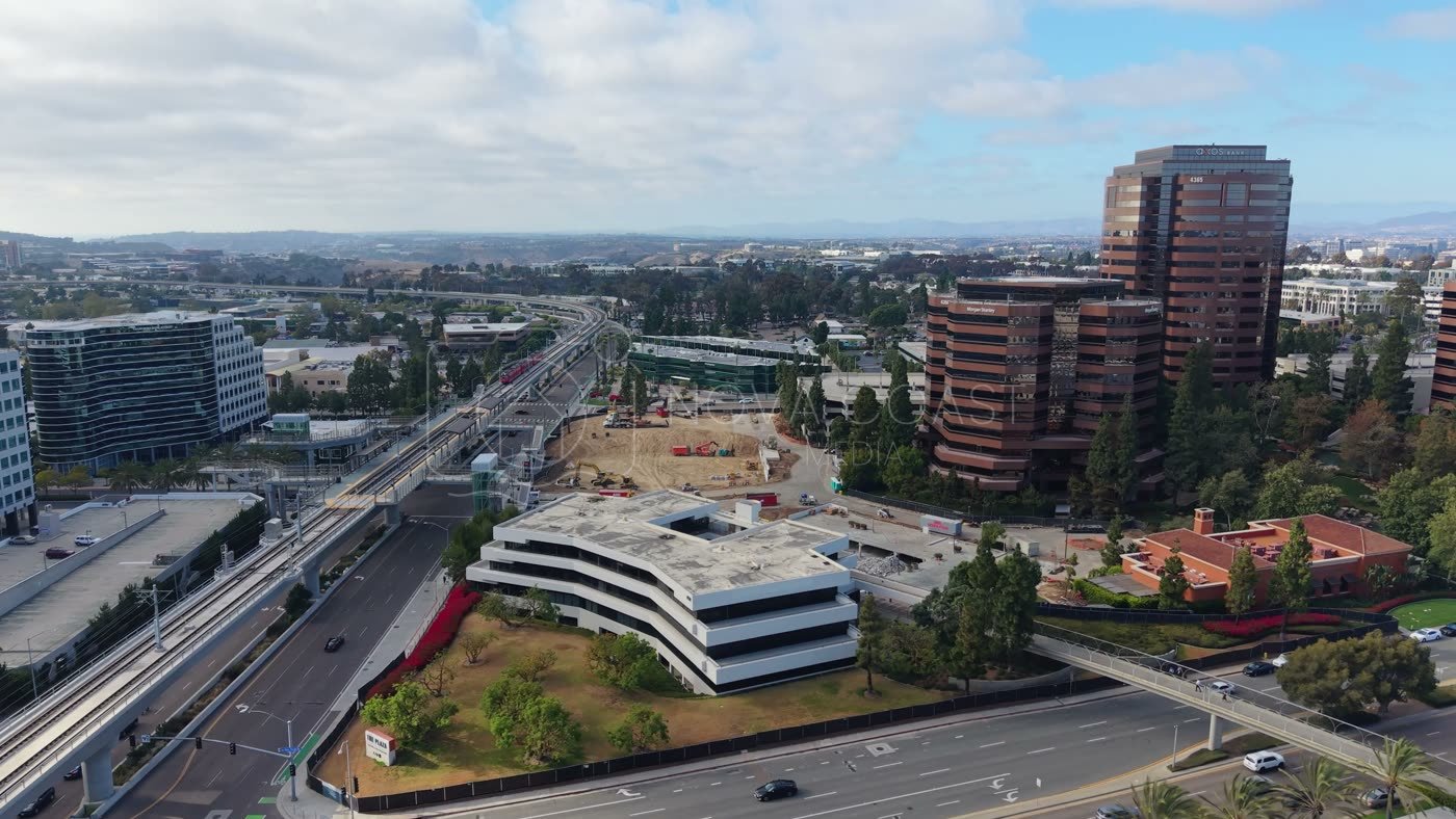 The Blue Line Trolley Threading Through University City’s Office District – Golden Hour Frame