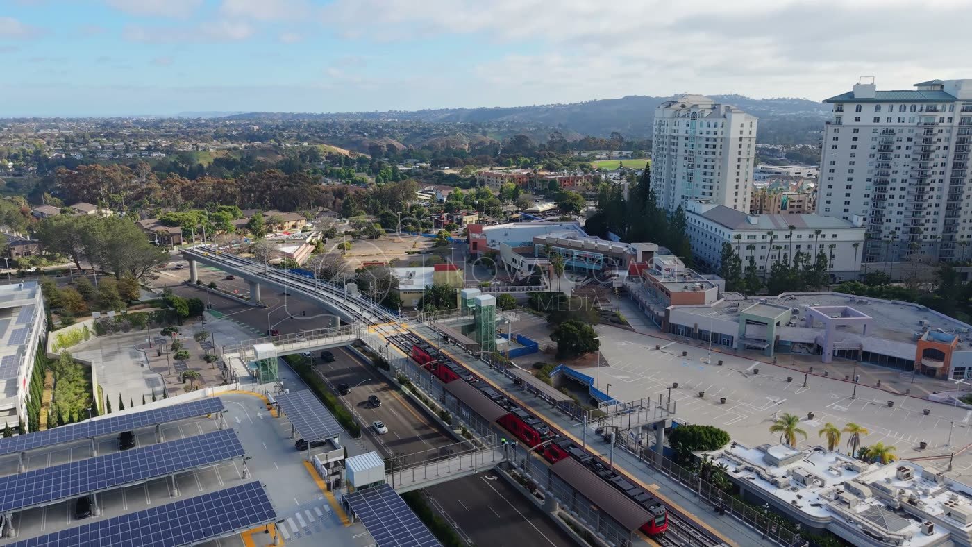 Trolley Arriving at the UTC Transit Center Below Residential Towers – Golden Hour Frame