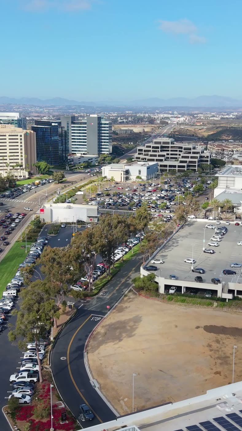 University Town Center Office Towers and Boulevard from Above – Wide Establishing Frame (Vertical)