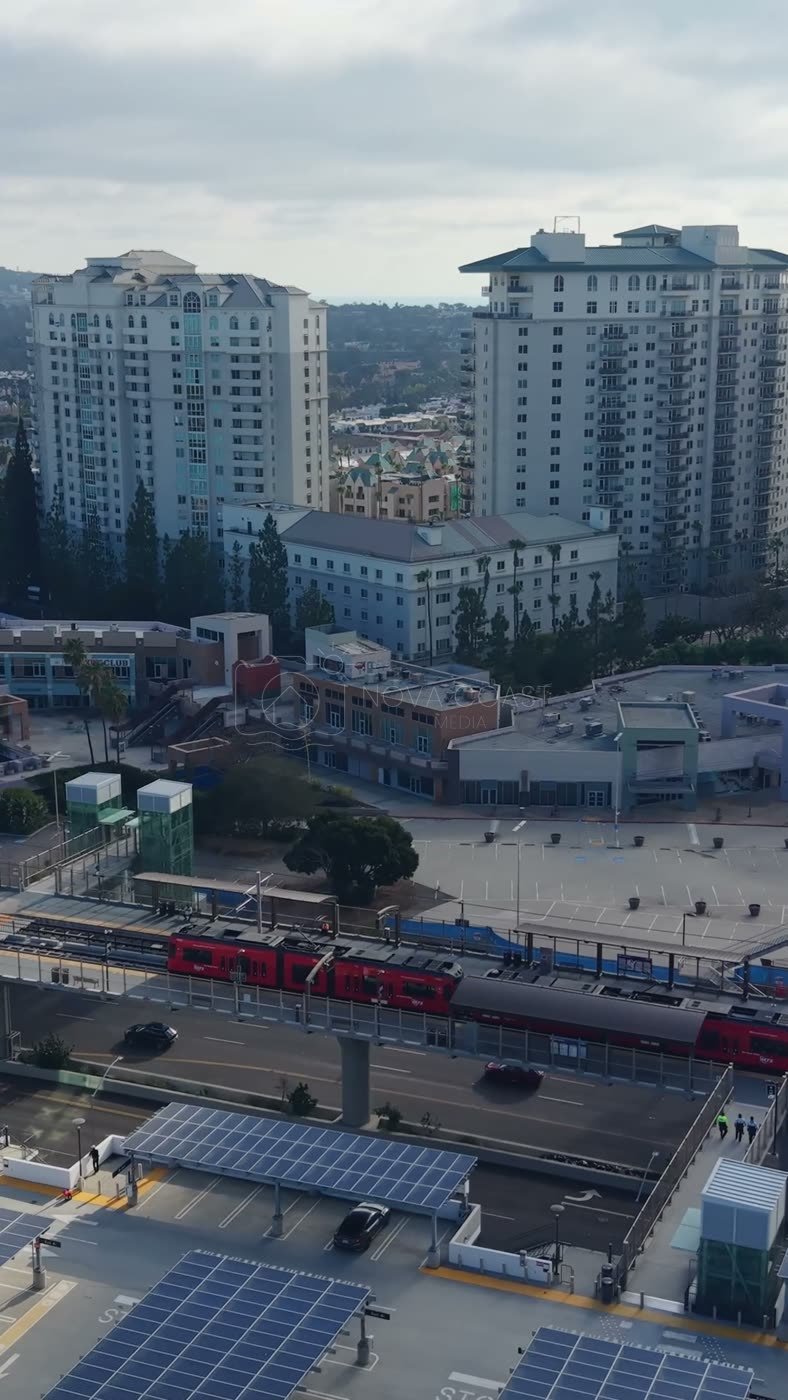 Trolley Arriving at the UTC Transit Center Below Residential Towers – Elevated Perspective (Vertical)