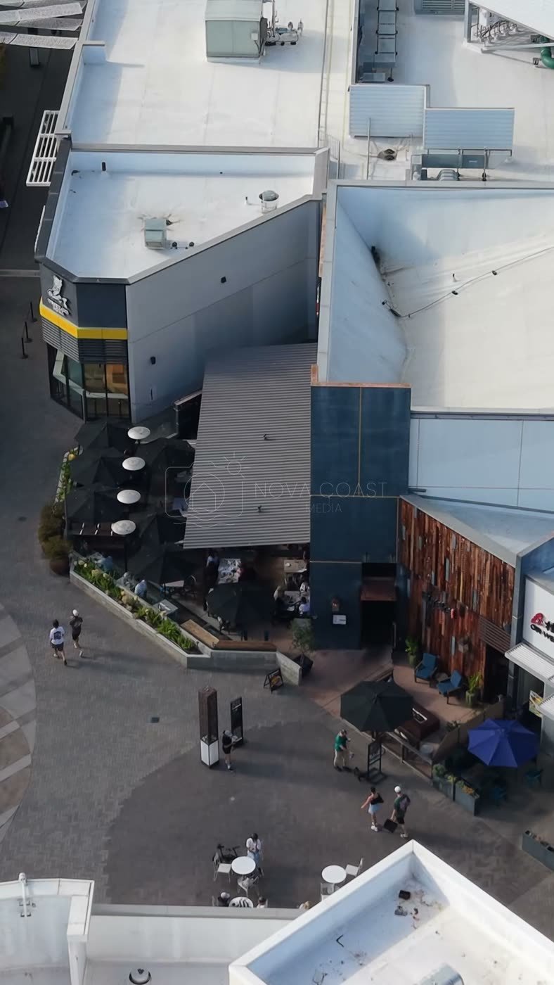 Outdoor Dining Terrace and Shops at University Town Center – Aerial View (Vertical)
