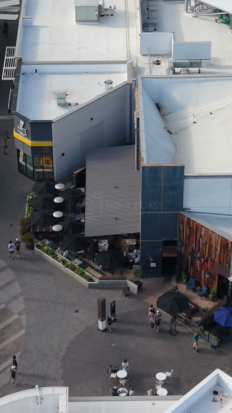 Outdoor Dining Terrace and Shops at University Town Center – Elevated Perspective (Vertical)