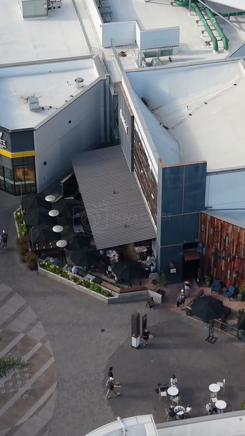Outdoor Dining Terrace and Shops at University Town Center – Wide Establishing Frame (Vertical)