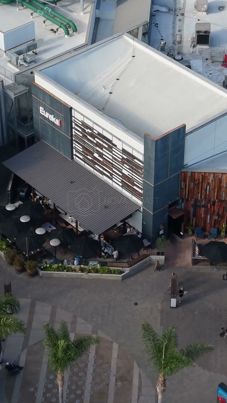 Outdoor Dining Terrace and Shops at University Town Center – Golden Hour Frame (Vertical)