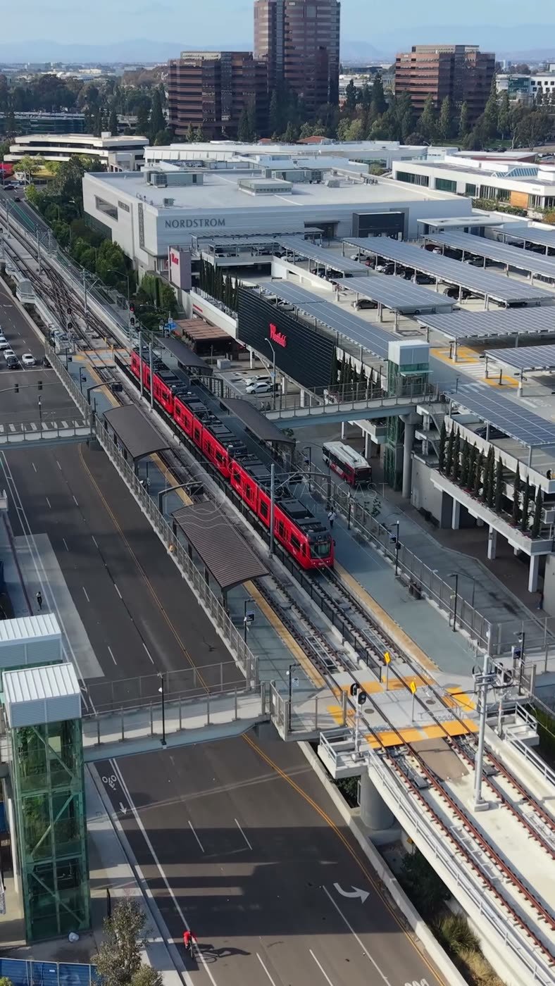Aerial of the UTC Trolley Station and University City High-Rises – Golden Hour Frame (Vertical)