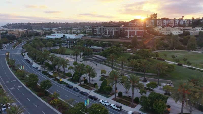 Civita Palm-Lined Boulevard and Park as the Sun Sets Over the Ridge