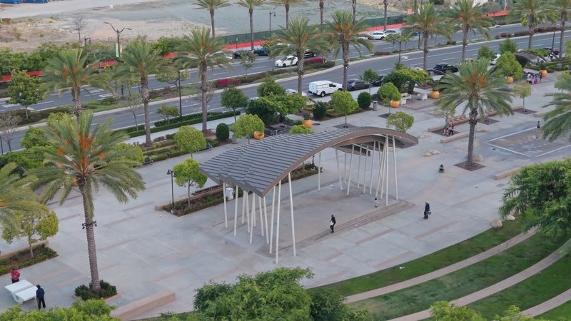 Architectural Detail of Civita Park’s Arched Canopy and Palm Plaza – Wide Establishing Frame