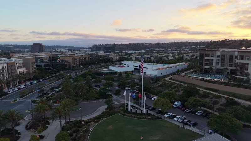 Civita Hilltop Residences Above the Community Garden Terraces at Dusk – High-Angle Panorama