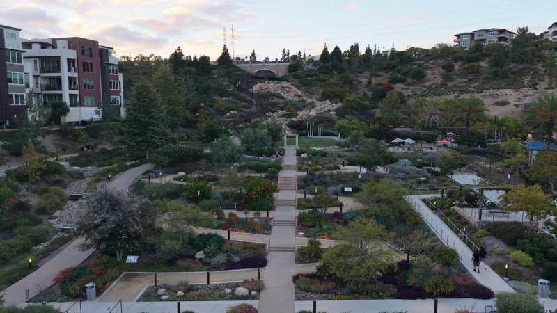 Civita Terraced Botanical Gardens and Winding Pathways at Twilight – Aerial View