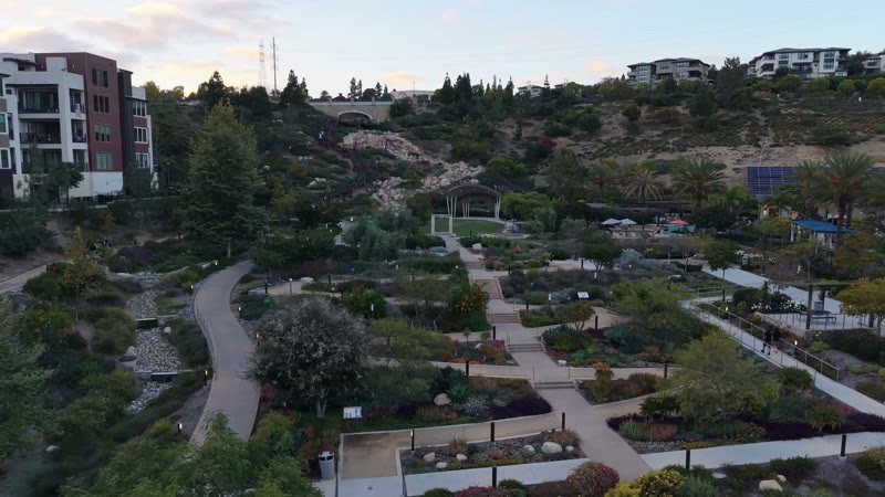 Civita Terraced Botanical Gardens and Winding Pathways at Twilight – Wide Establishing Frame