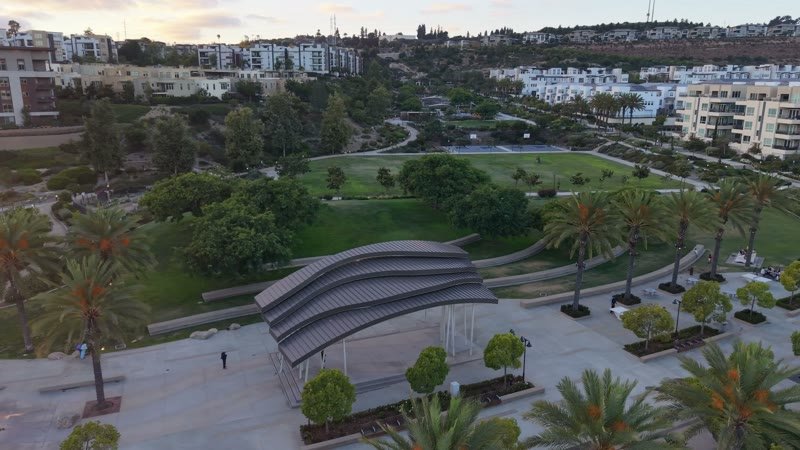 Civita Park Curved Steel Amphitheater Pavilion Above the Green – Aerial View
