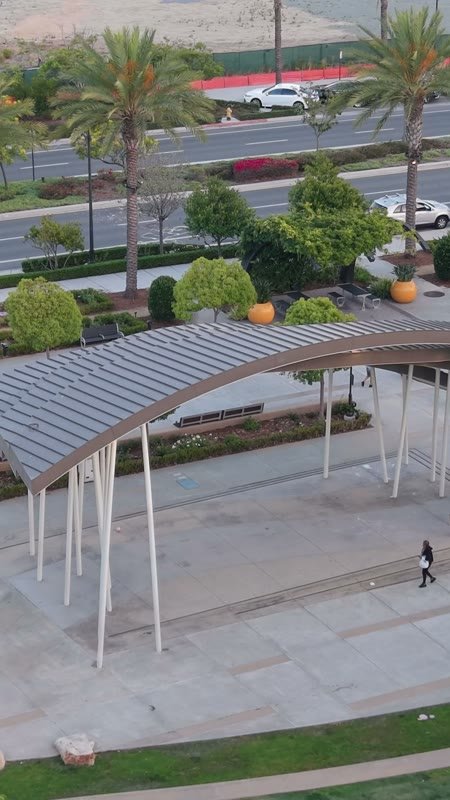 Architectural Detail of Civita Park’s Arched Canopy and Palm Plaza – Aerial View (Vertical)