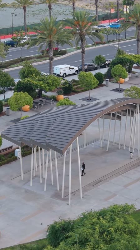 Architectural Detail of Civita Park’s Arched Canopy and Palm Plaza – Overhead Detail (Vertical)