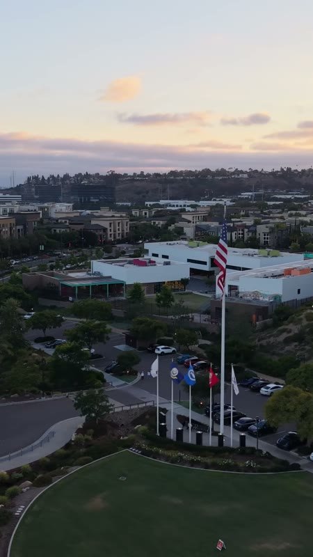 Civita Hilltop Residences Above the Community Garden Terraces at Dusk – High-Angle Panorama (Vertical)