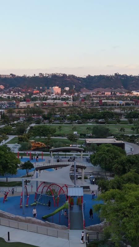 Civita Park Playground and Green Space Framed by Mission Valley Hills – Aerial View (Vertical)